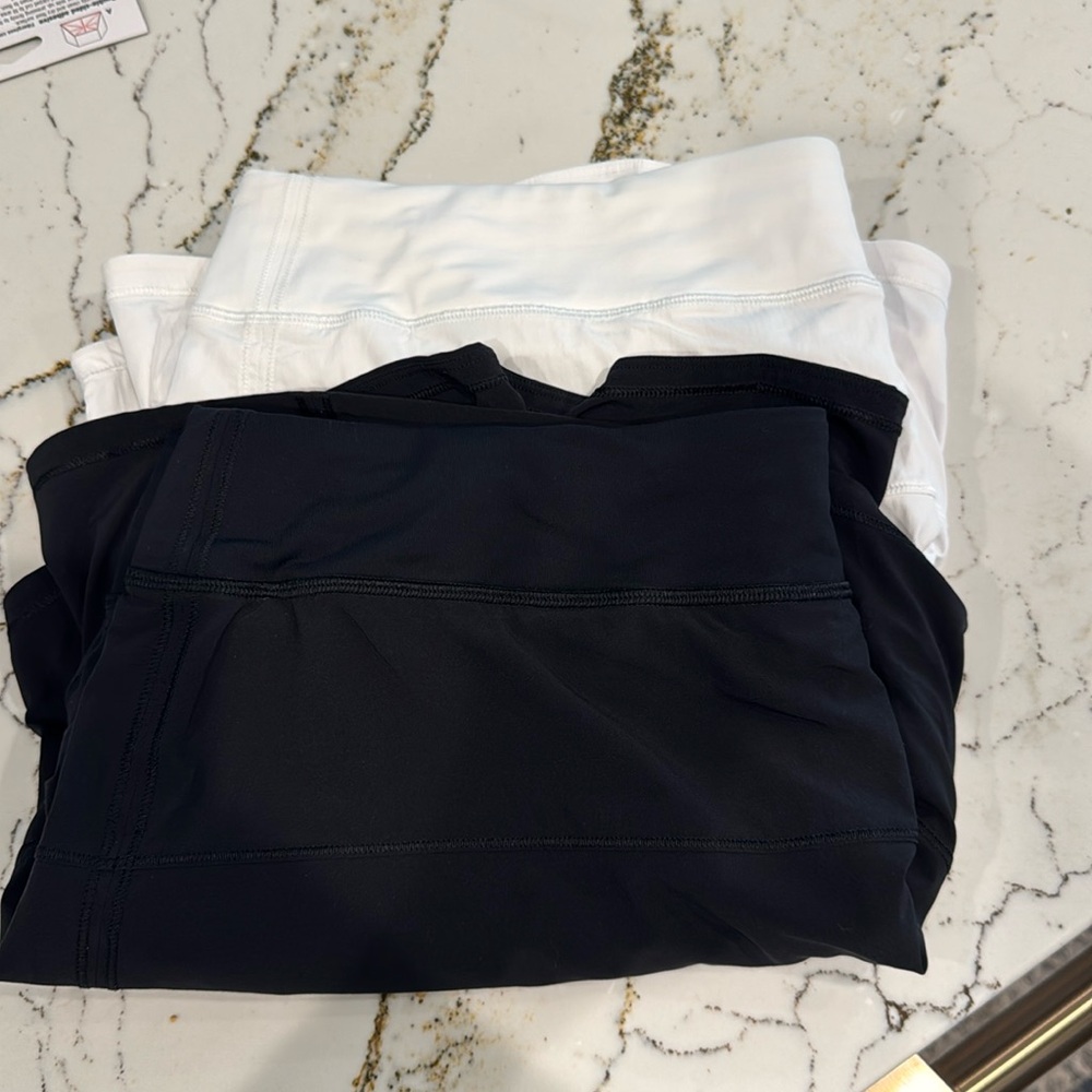 2 lululemon tennis skirts. Size 16-black and white
